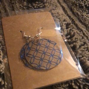 Homemade wooden earrings in shiny blue